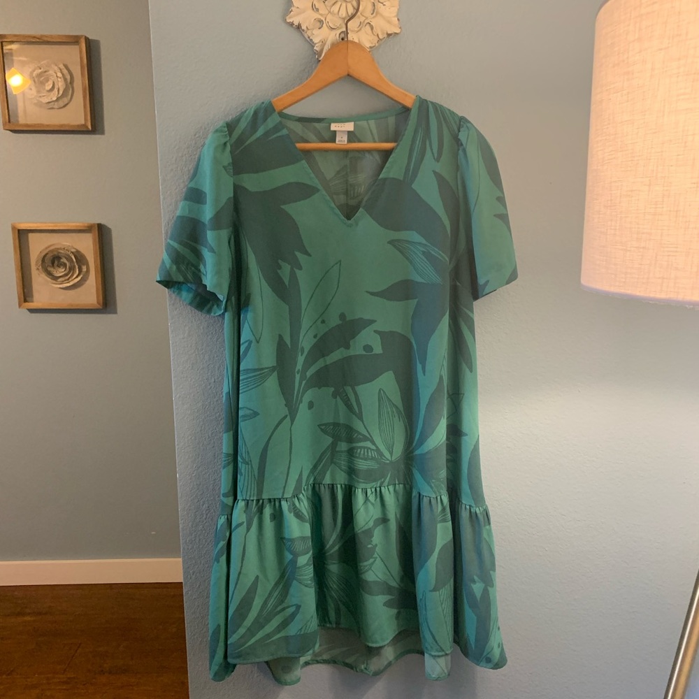 Green and white flowing dress